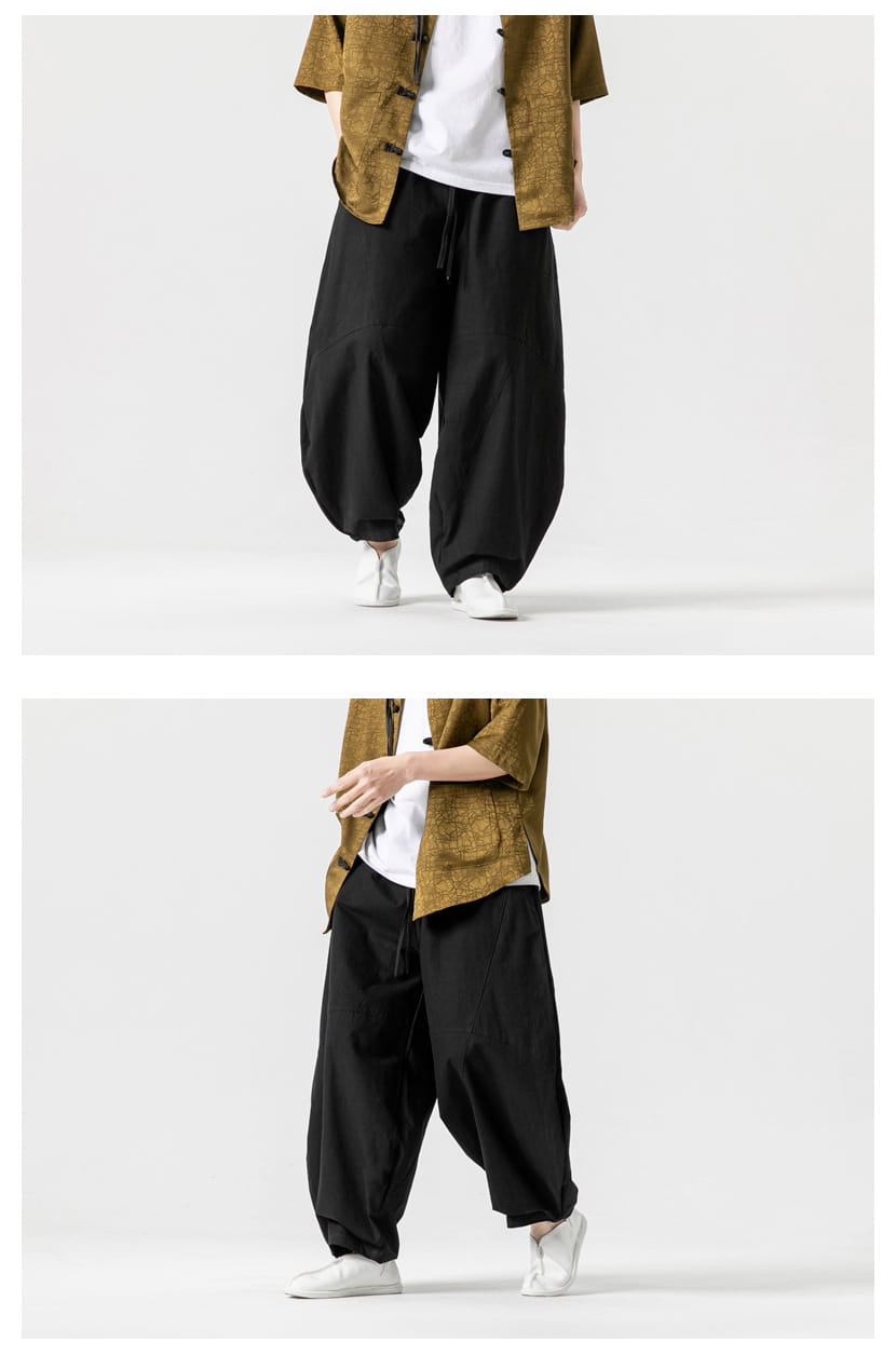 Pantalon ample en toile de tai-chi noir avec taille à cordon et chevilles fuselées, conçu comme pantalon décontracté et relax