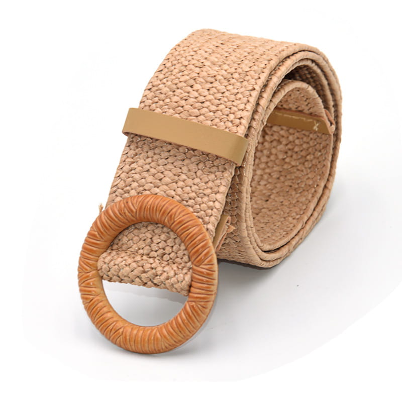 Beige woven elastic belt with a round textured straw buckle.