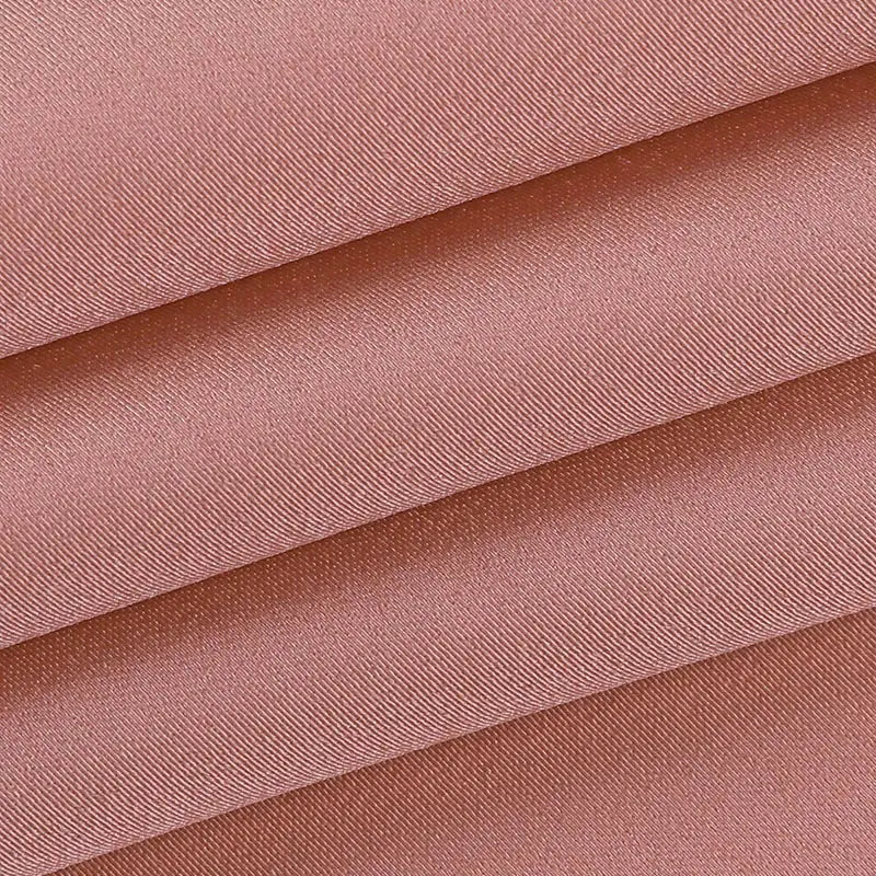 A satin halter mini party dress made of soft rose-colored satin fabric with a subtle diagonal weave pattern.