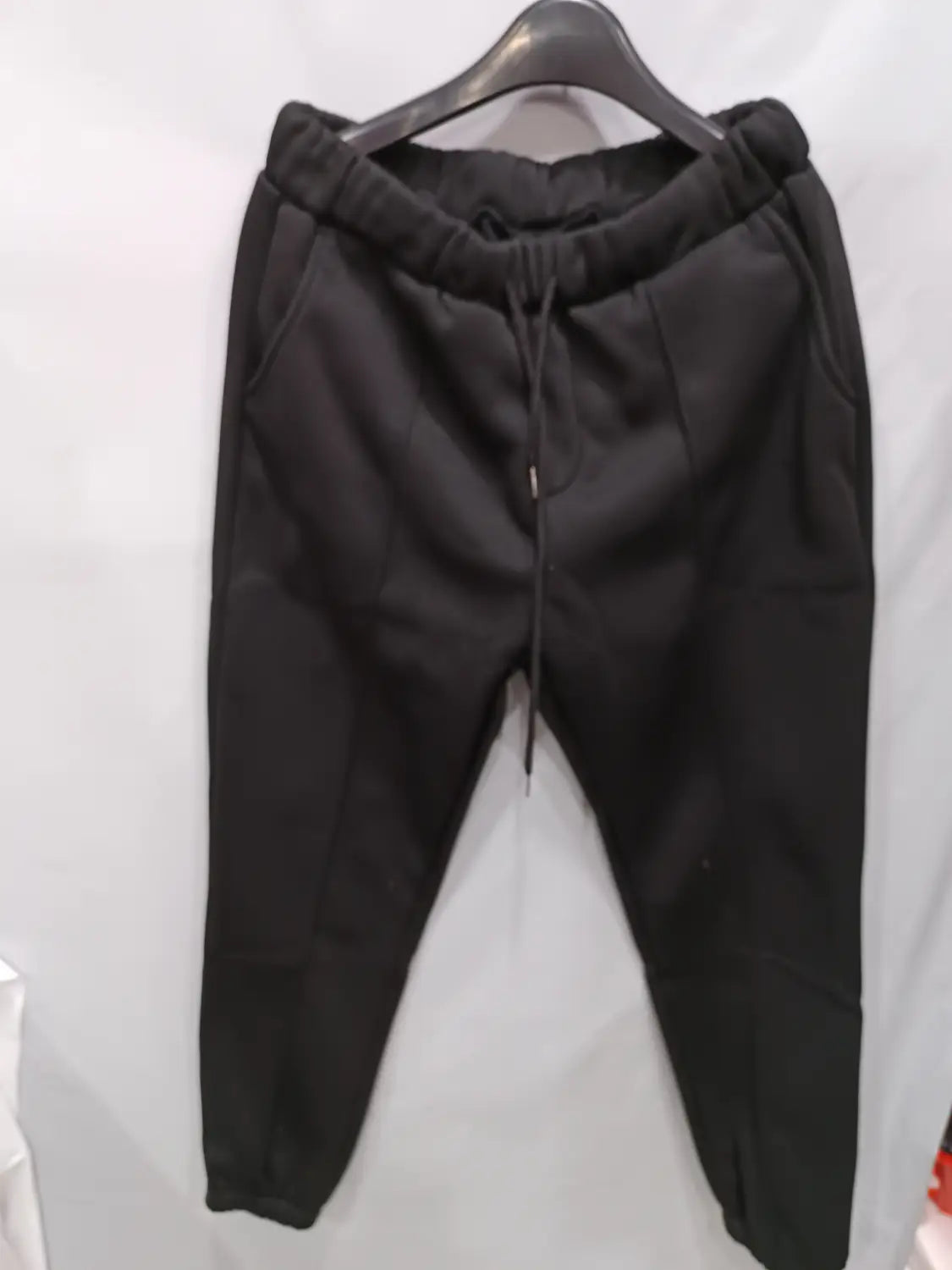 men’s fleece drawstring sweatpants in black featuring soft stretchy fabric, elastic cuffs, and a comfortable fit.