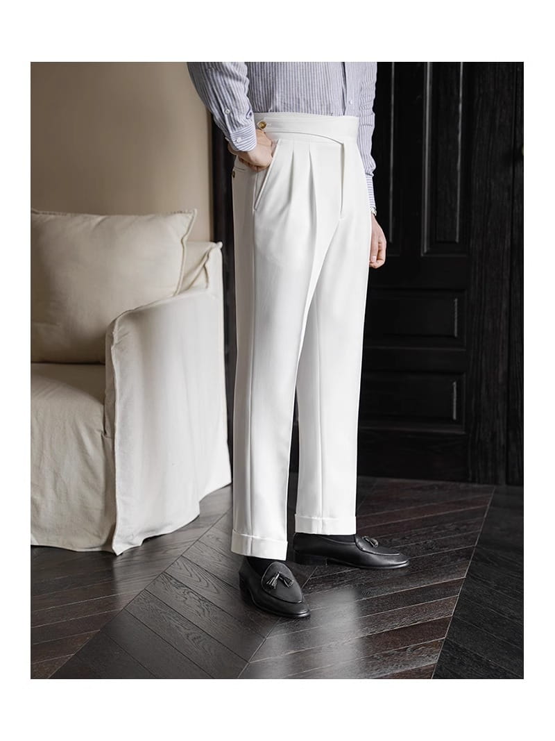 Men’s tailored pleated wool straight leg trousers in white with a tailored fit and rolled cuffs.
