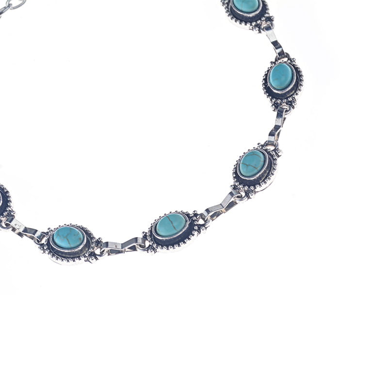 Silver-toned vintage turquoise silver ornate boho anklet featuring five oval turquoise stones set in darkened metal bezels.