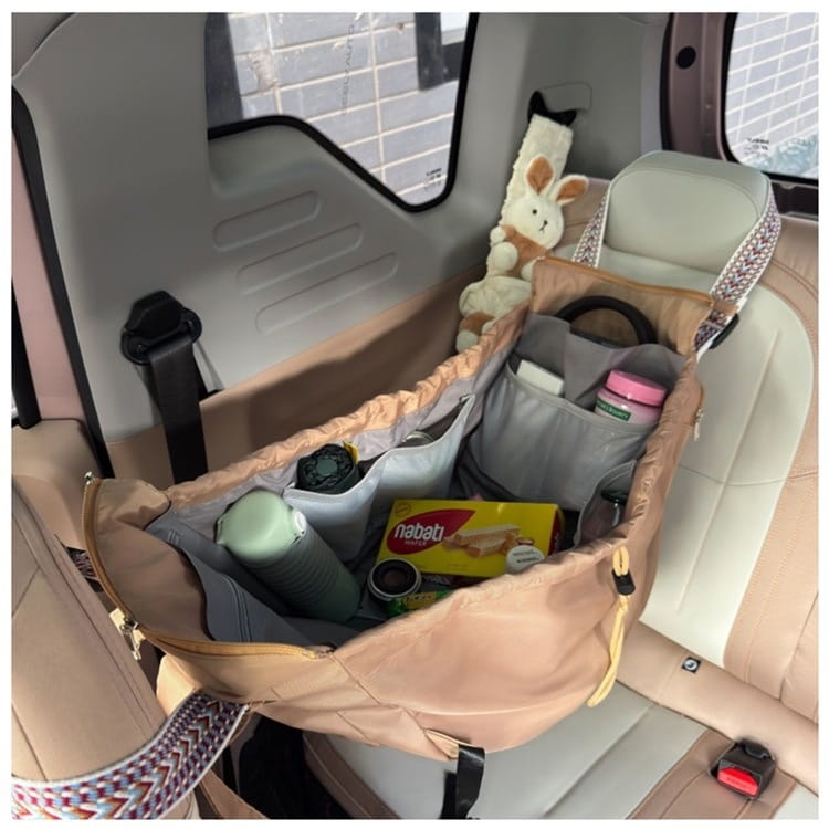 Beige and gray multifunctional waterproof nylon fashion tote and backpack featuring a multi-compartment car seat organizer with a woven strap.