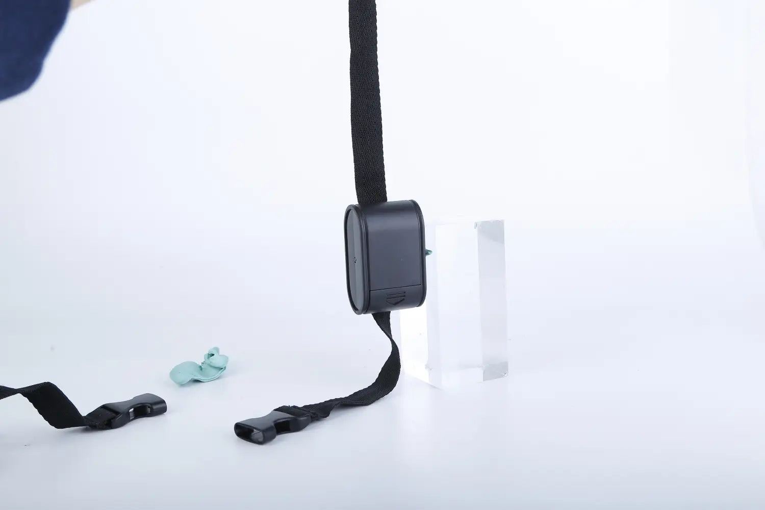 black rectangular electric dog fence system with water resistant collar featuring adjustable strap and buckle components for pet containment.