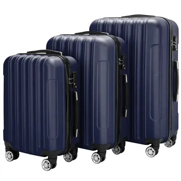 Set of three navy blue hard shell spinner suitcases with vertical ridged design and silver toned hardware.