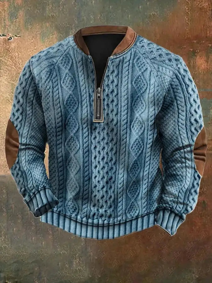 Men’s blue cable knit half zip sweater with brown leather collar and elbow patches.