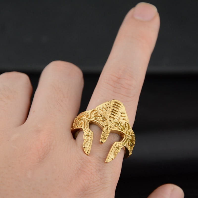 Gold-plated spartan warrior helmet ring in stainless steel with intricate engraved detailing.