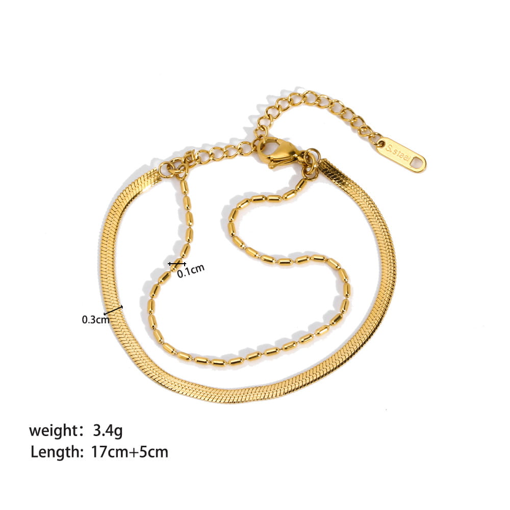 18k gold pvd plated stainless steel snake chain anklet with a sleek interlocking link design and a secure clasp.