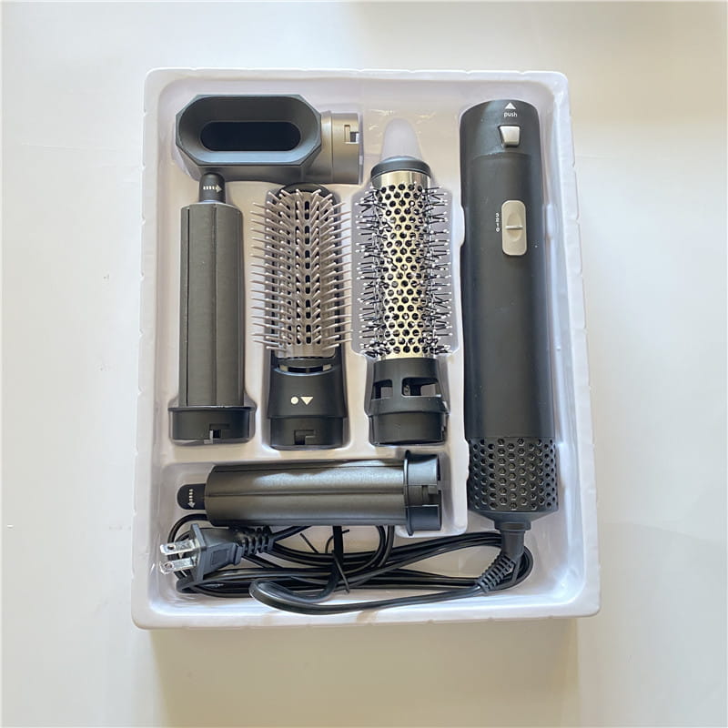 Black and silver 5-in-1 hot air comb hair dryer and styler set with multi-functional attachments including a round brush, straightener, and diffuser for versatile hair styling.