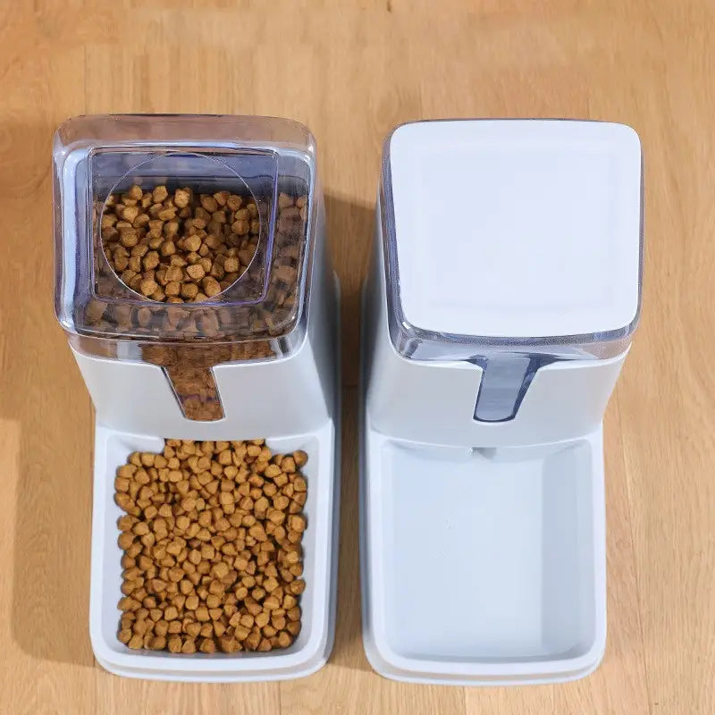 Automatic pet feeder and water dispenser featuring a white plastic body with a transparent top and a food compartment filled with brown kibble.