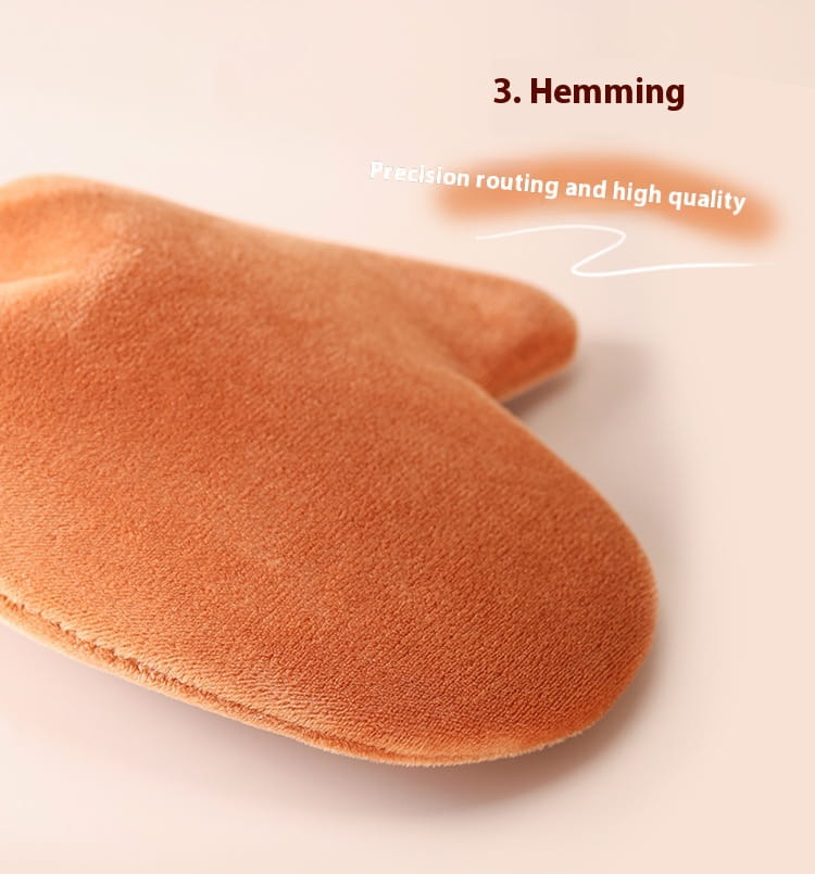 Soft rust-colored velvet tanning mitt with precise hemming and high-quality stitching from exfoliating bath glove set