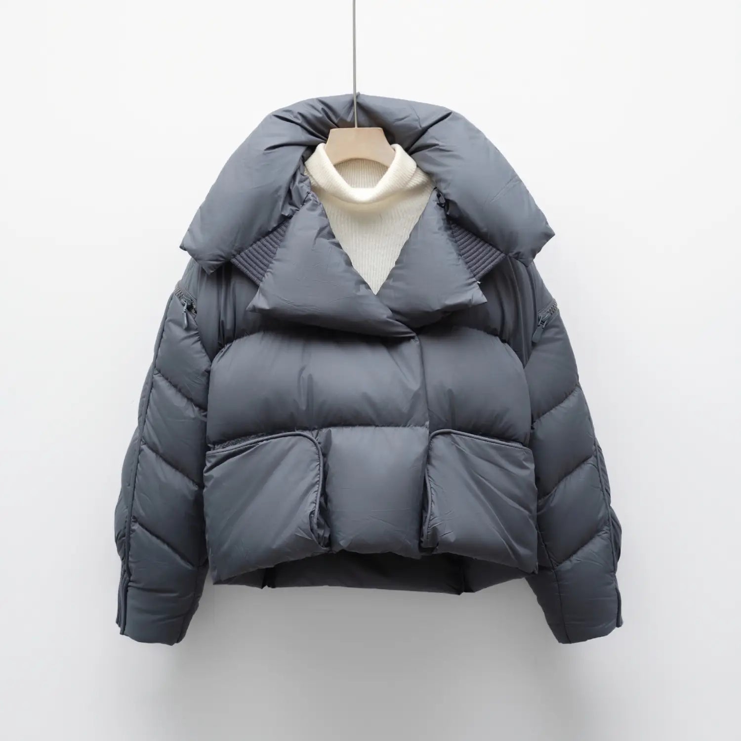 Dark gray quilted down jacket patchwork large lapel in Korean style featuring a voluminous hood and front pockets.