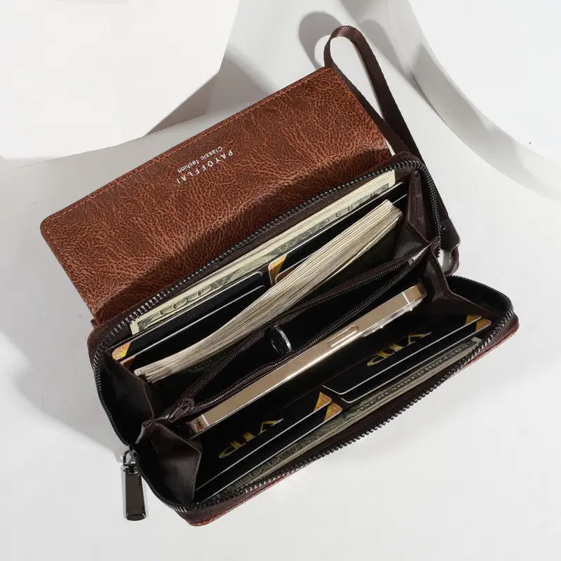 Men’s pu leather long wallet in brown with multiple compartments and a wrist strap for secure carrying.