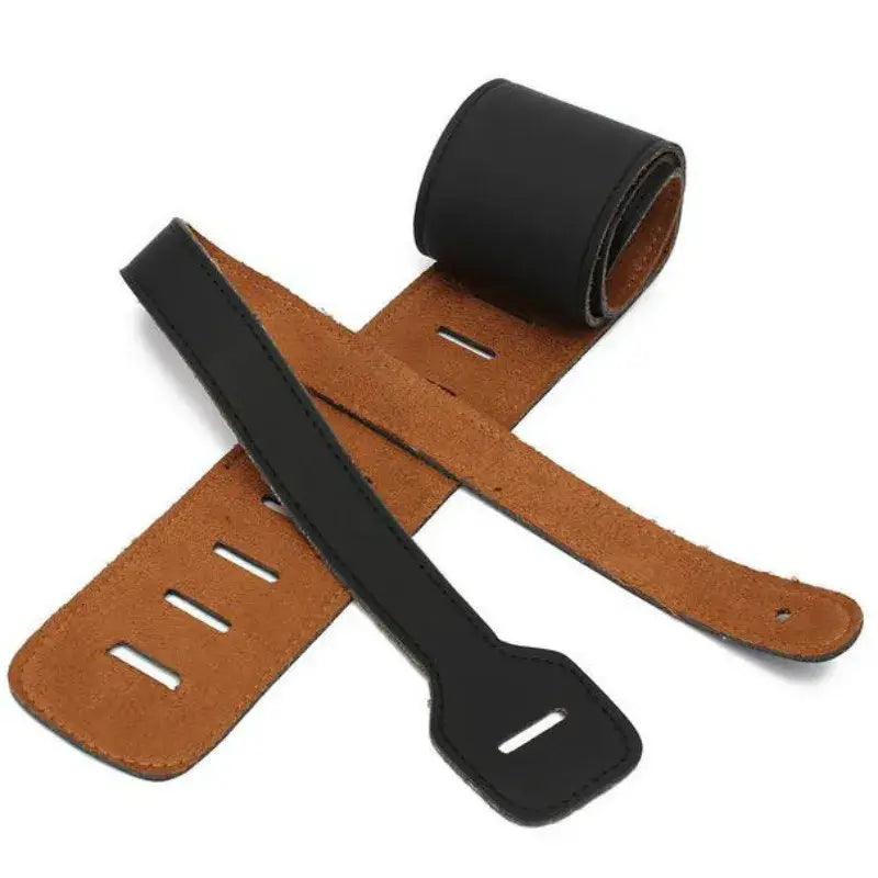 Black and tan leather guitar strap with adjustable holes and rolled end featuring suede lining for length between 110 and 130 cm