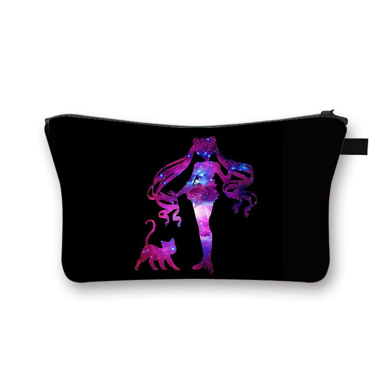 Black cosmetic bag featuring a vibrant galaxy-themed silhouette of a girl with long hair and a cat in shimmering purples pinks and blues from the whimsical bow and lace travel clutch collection.
