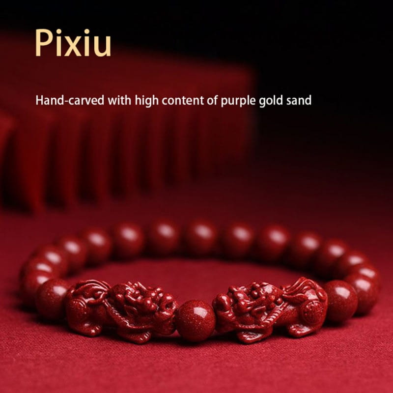 Hand carved purple gold cinnabar double pixiu bracelet featuring a red hand carved pixiu and high content purple gold sand beads.