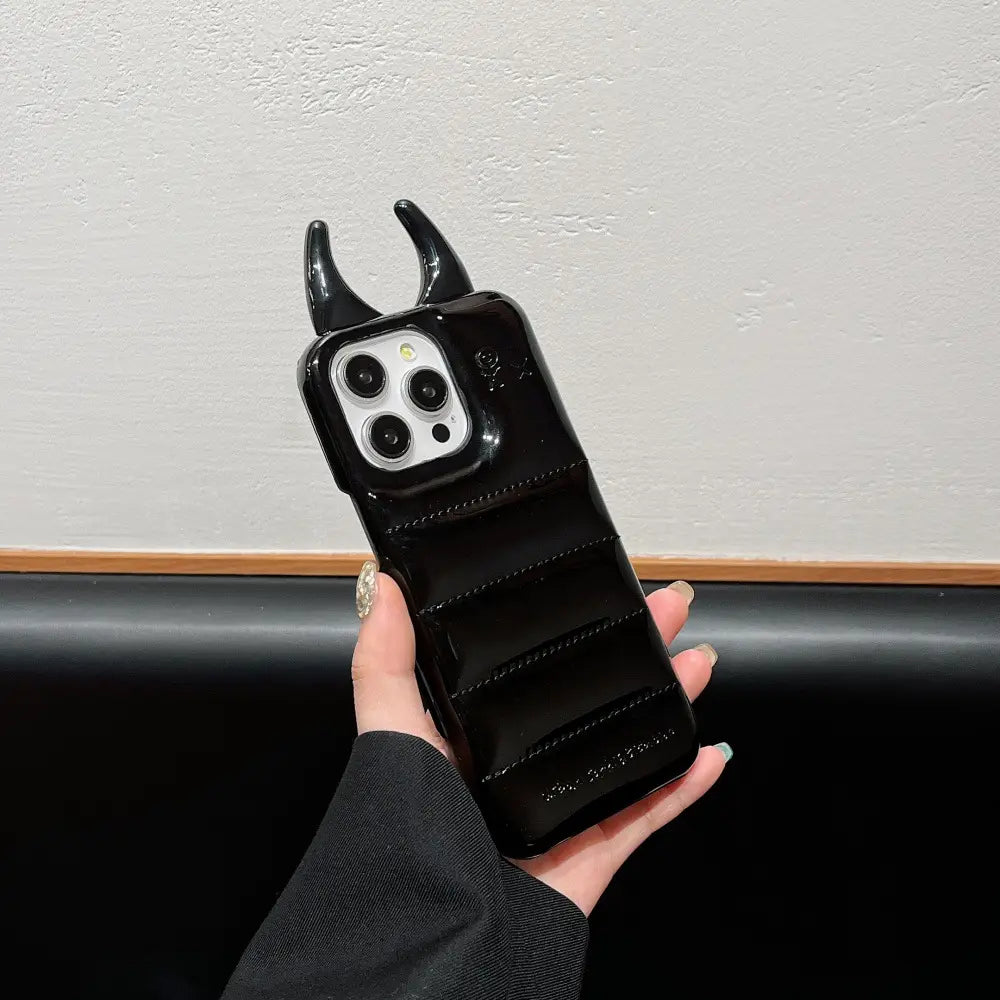 black glossy devil horn quilted leather iphone case showing the back with horn-like protrusions and horizontal ridges designed to resemble a beetle or insect