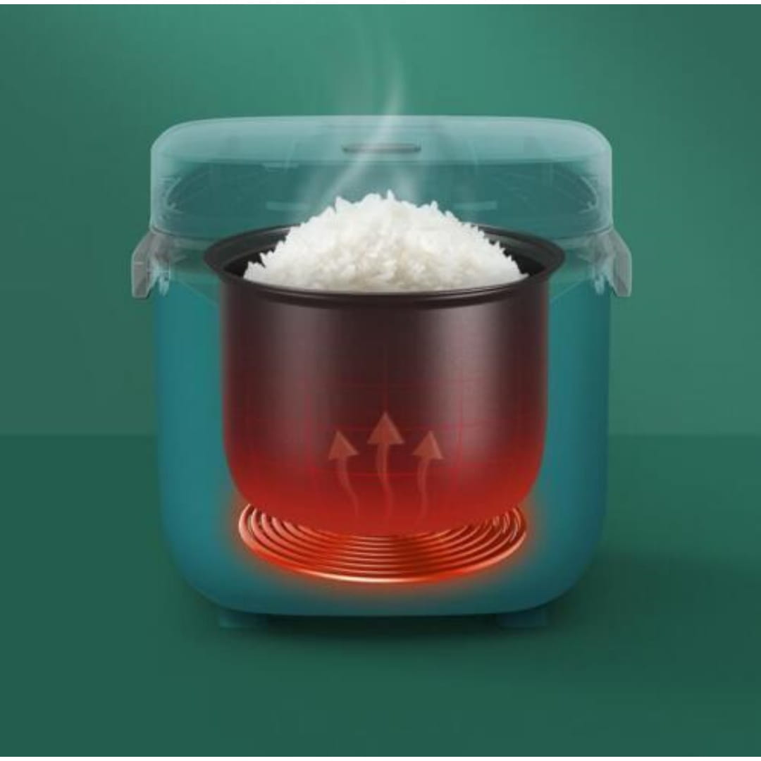 Cocotteuse à riz bleue de 1,2 L, cuiseur vapeur électrique, avec un revêtement intérieur noir antiadhésif rempli de riz blanc à la vapeur, et des éléments chauffants rouges visibles à la base.