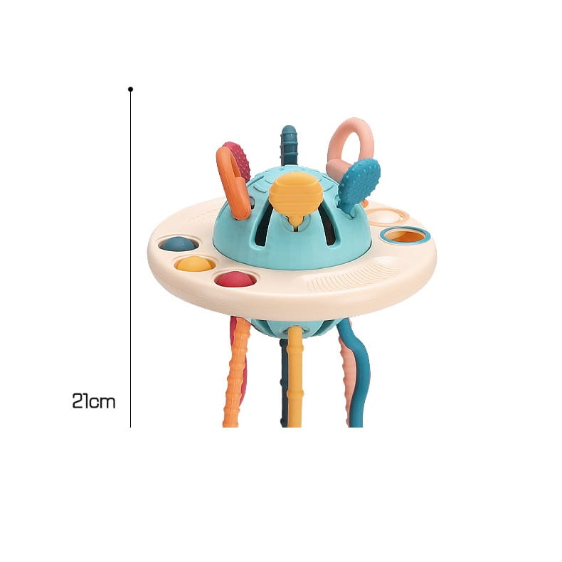 Juguete mordedor sensorial de silicona para bebé con cintas, que presenta un centro de actividades de plástico colorido de 21 cm de altura con una cúpula azul claro, base beige y múltiples aros texturizados, botones y apéndices colgantes en naranja, azul verdoso, rosa y amarillo.