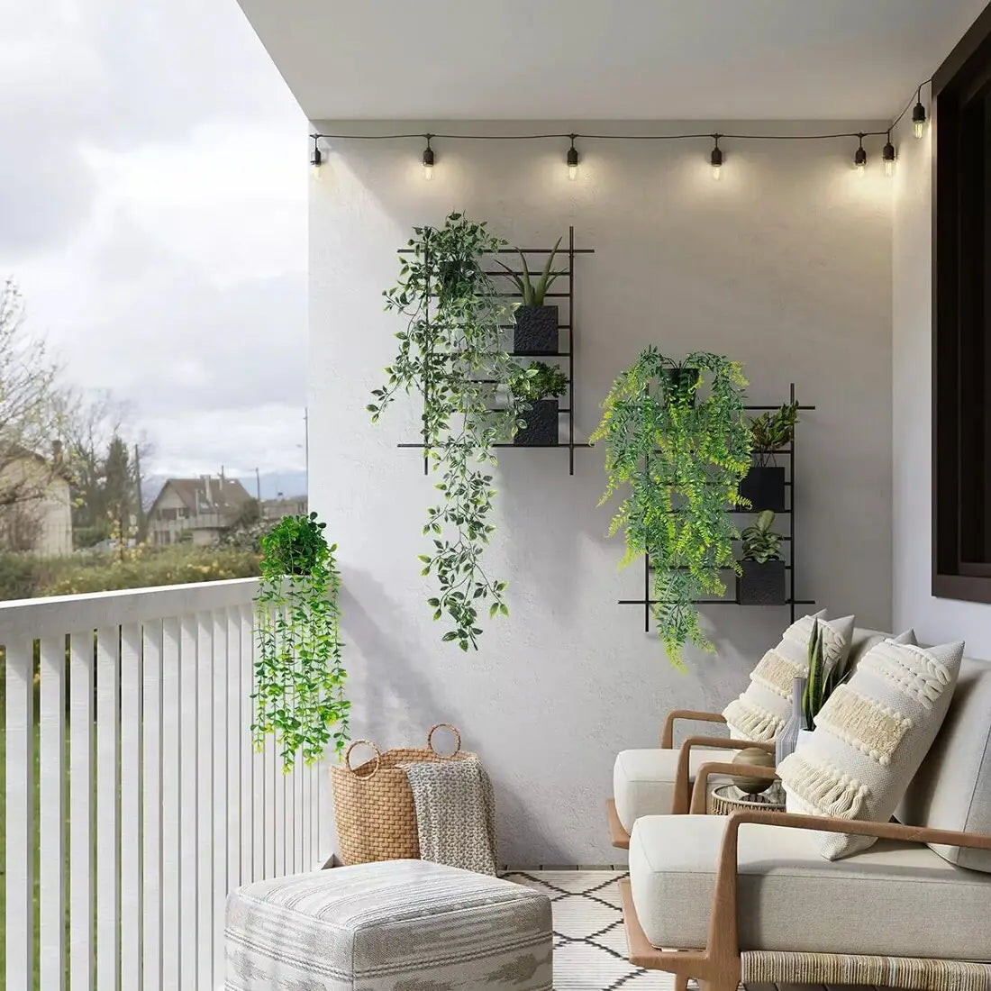 Beige upholstered armchair with wooden frame and textured throw pillows placed near artificial hanging plants 3 pack fake trailing greenery.
