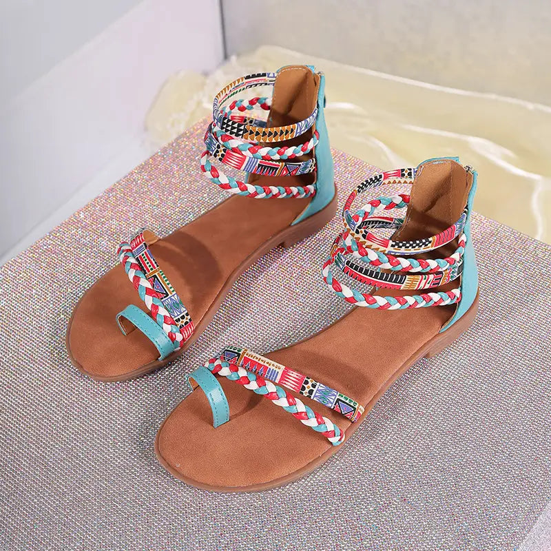 Bohemian ethnic braided ankle strap flat sandals featuring colorful braided design with turquoise accents and patterned straps.