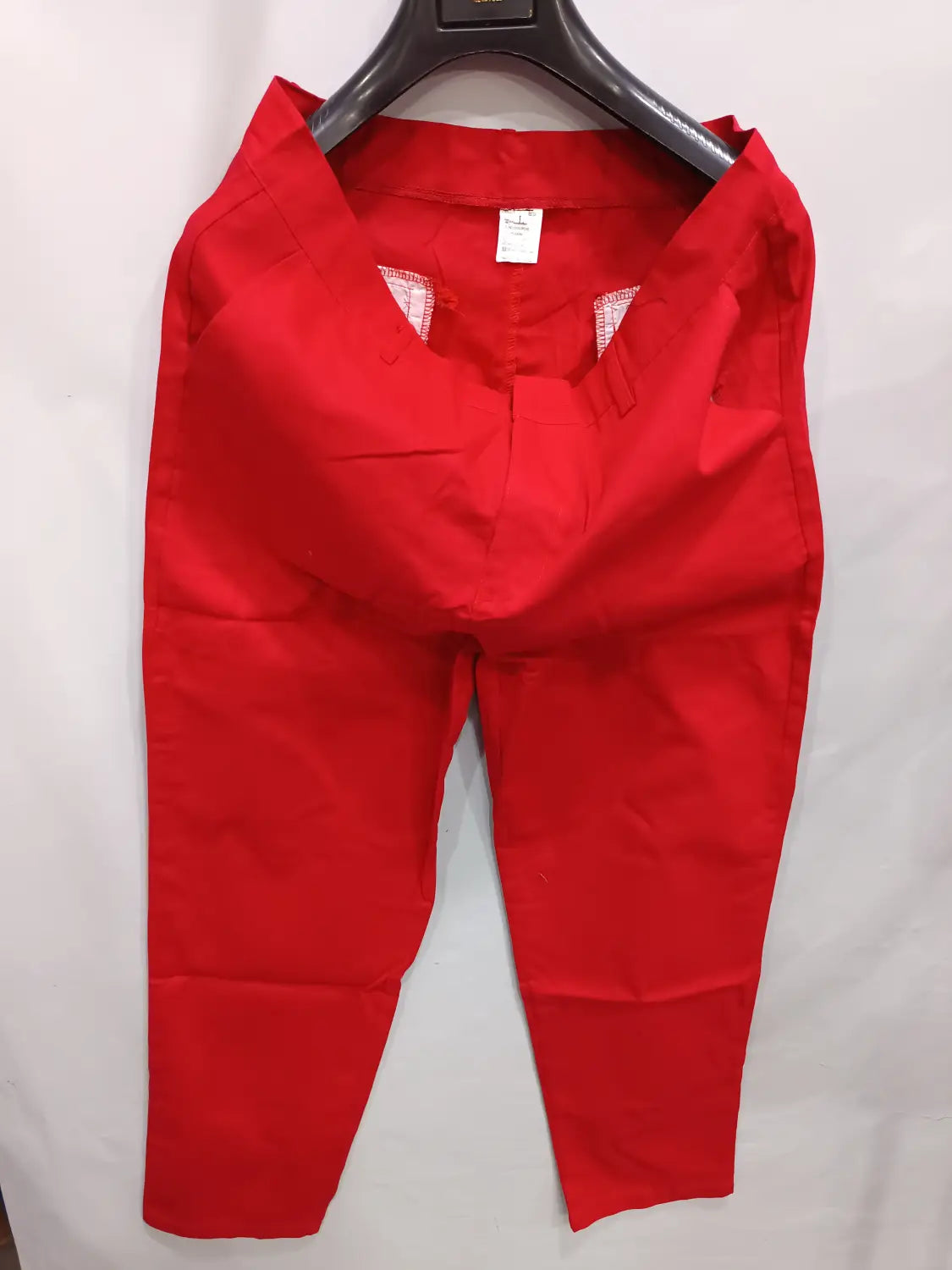 Men’s casual slim fit chinos in bright red with straight-leg tailored fit and visible stitching details.
