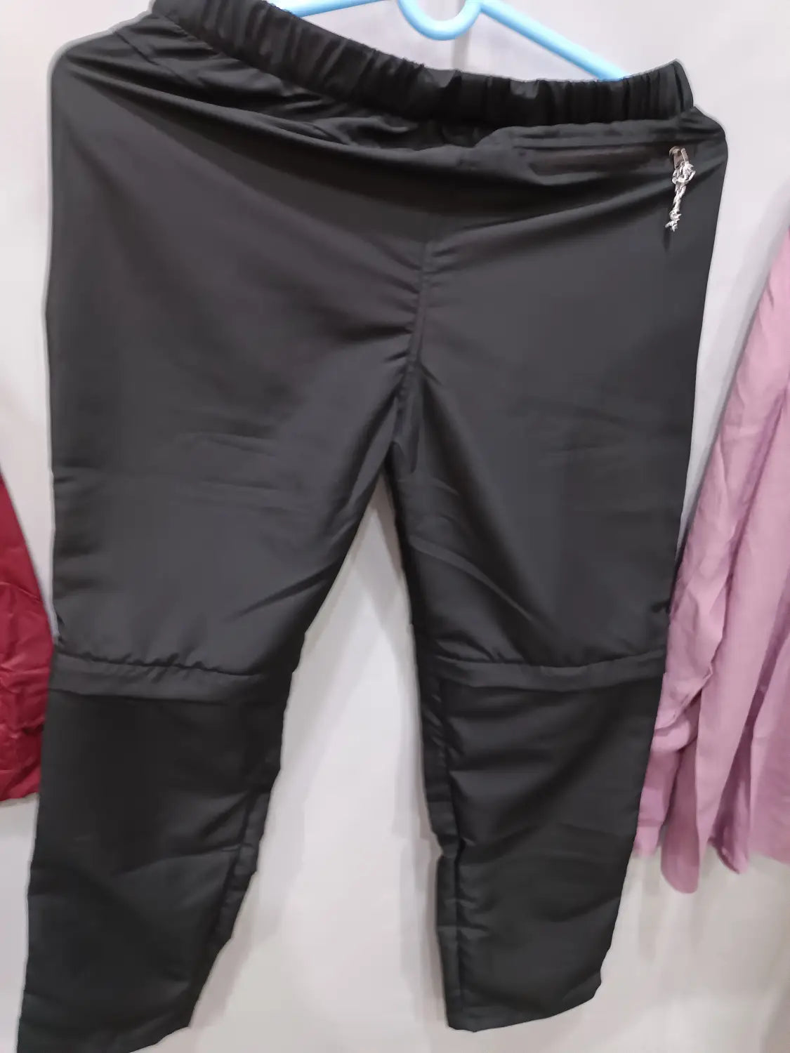 black convertible tactical hiking pants with elastic waistband and reinforced knee panels designed for durability and comfort