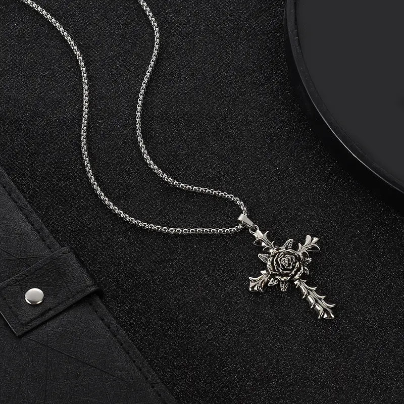 Detailed silver rose cross pendant necklace with a textured silver chain displayed on a white background.