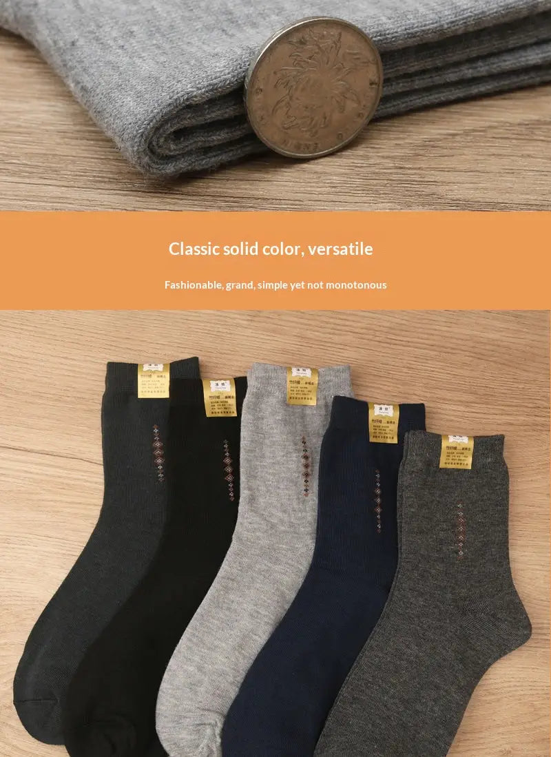 Men mid calf crew socks 5 pack featuring classic solid colors black gray and navy blue with subtle embroidered details on the side.
