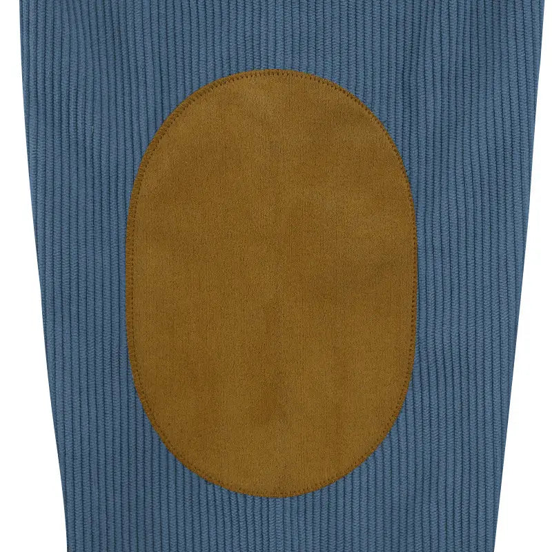 blue corduroy pants with a tan suede elbow patch featured in a slim fit corduroy patchwork pullover with contrast accents
