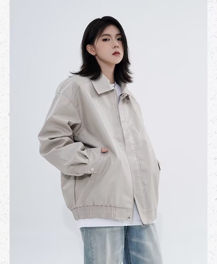 Men’s beige faux leather bomber jacket with a relaxed fit, ribbed cuffs and hem, and front zipper closure designed for outerwear.