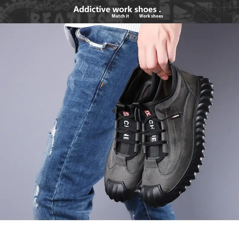 Men’s suede casual sneakers in dark gray with black rubber soles and laces featuring give branding designed for work use.