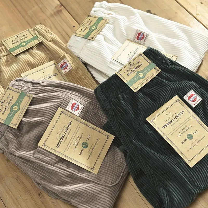 a collection of men’s premium ribbed corduroy drawstring shorts in beige white gray and dark green with ribbed texture and branded tags