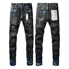 Men’s distressed slim fit dark-wash denim jeans with a splattered paint effect and contrasting blue stitching.
