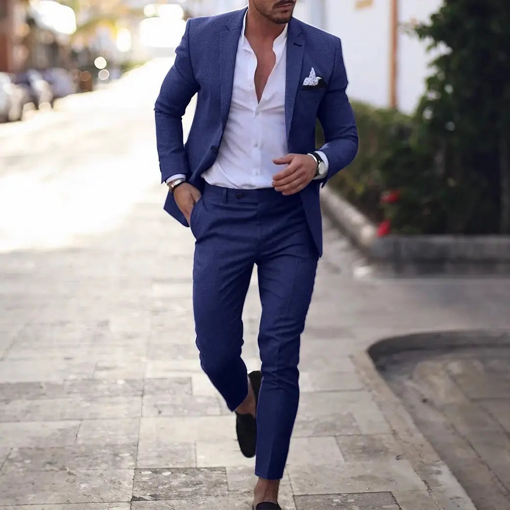 a sharp navy blue tailored men digital print casual suit set featuring a crisp white dress shirt and matching pocket square