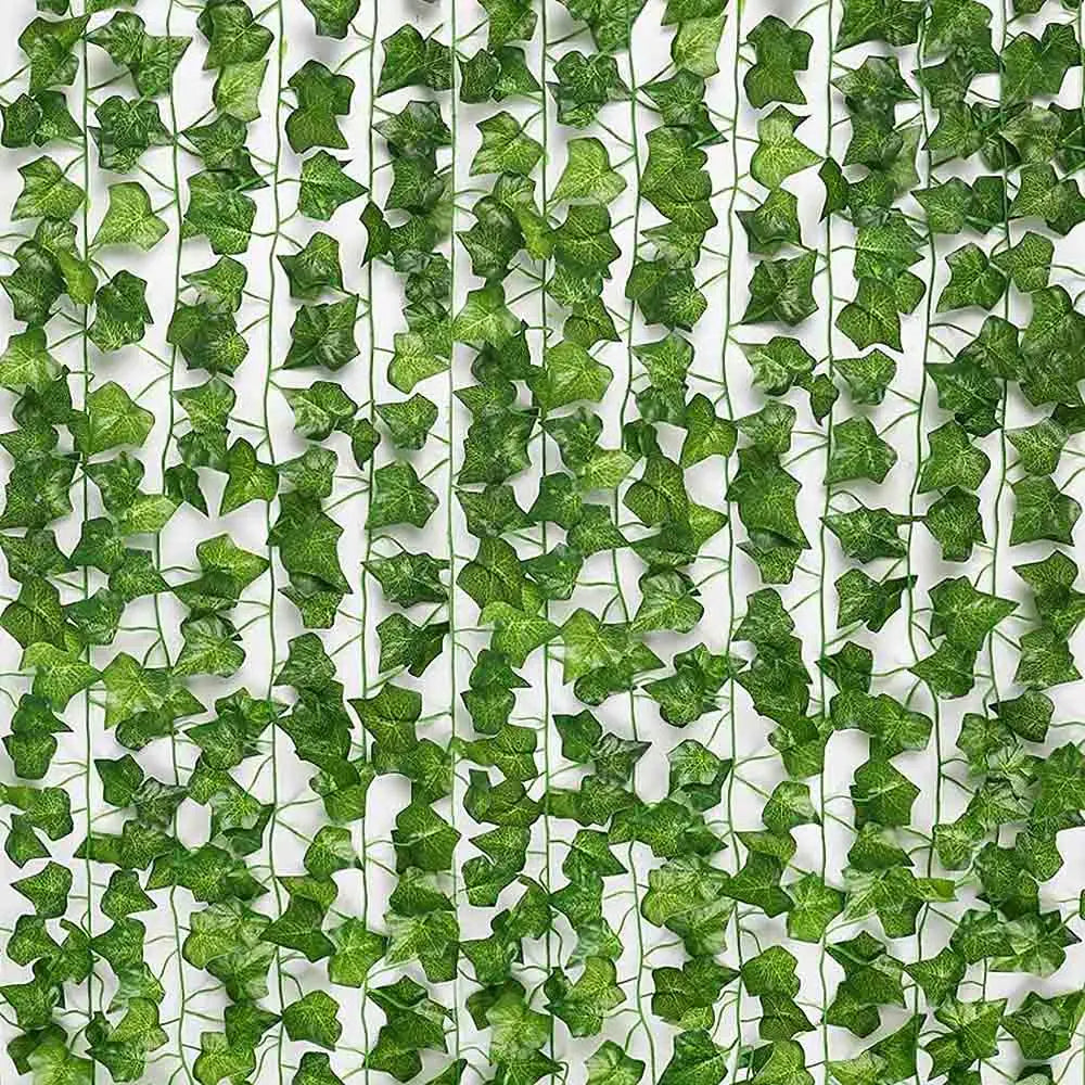 Green artificial ivy garland with realistic leaf texture and slender stems for hanging plant decor.