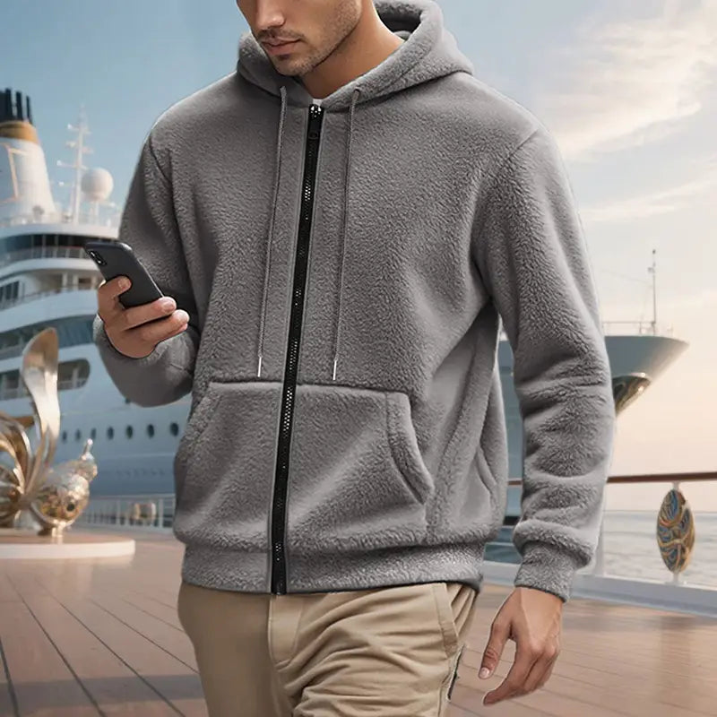 Men’s fleece lined loose zip up hooded jacket in gray with black zipper and matching drawstrings made of fleece material.