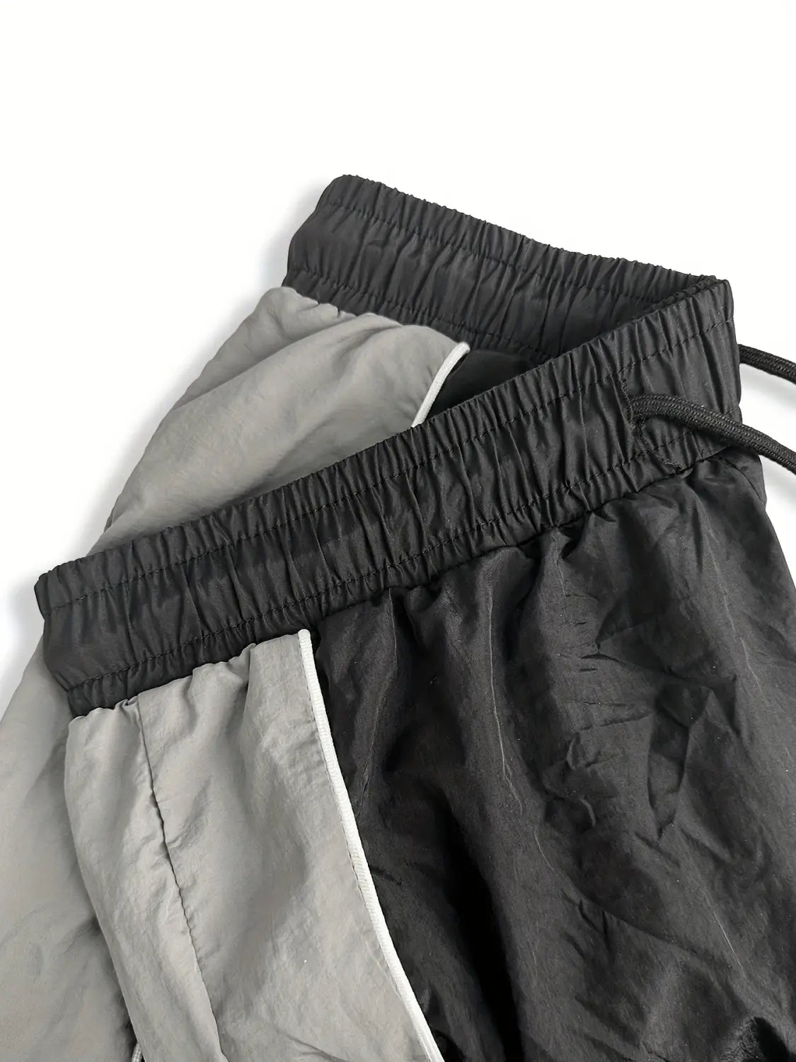 men quick dry athletic track pants in black and gray featuring an elastic waistband and drawstring for enhanced comfort and fit