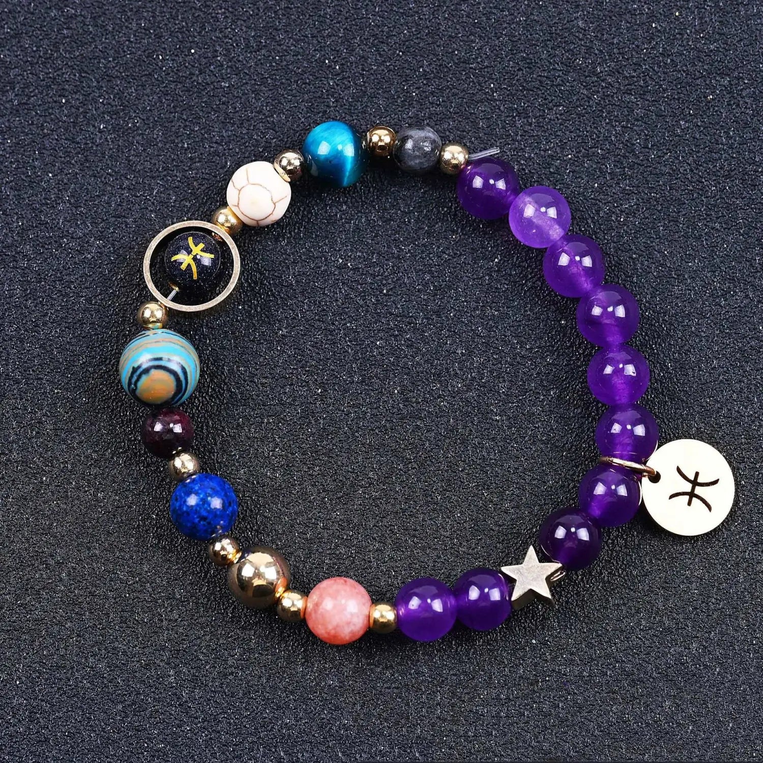 A colorful beaded bracelet featuring natural amethyst and agate stones in purple blue and pink with metallic accents and zodiac-themed charms.