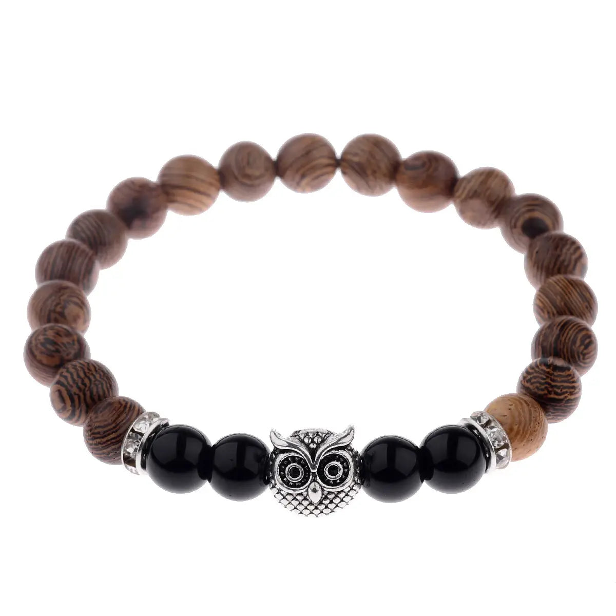 A brown wood-patterned beaded bracelet with a silver owl charm flanked by black onyx beads and crystal-encrusted metal spacers in the crystal owl charm wood and onyx beaded bracelet collection.