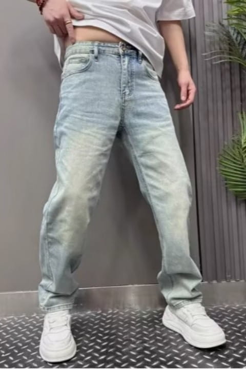 Men’s light wash relaxed straight leg denim jeans featuring a faded distressed look and classic five-pocket design.