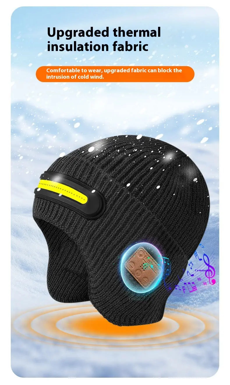 Black knitted winter beanie hat with integrated bluetooth speaker and reflective yellow stripe designed for running.