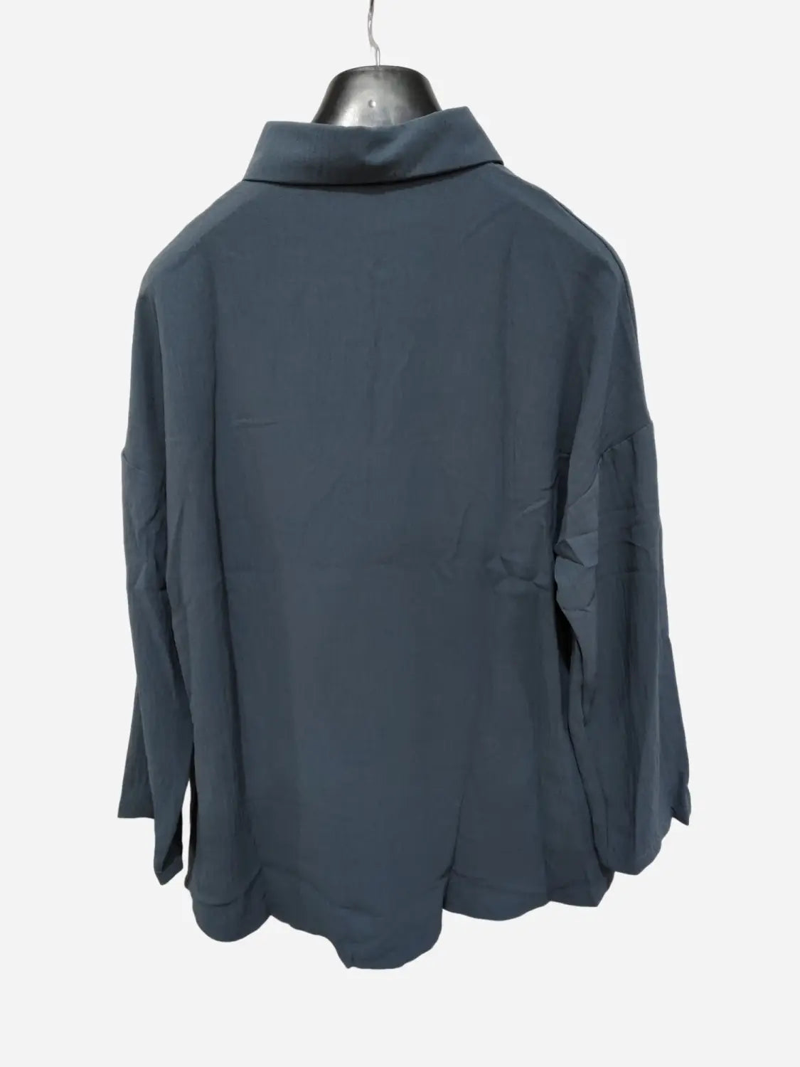 Women’s relaxed pleated button up shirt in dark gray with long sleeves and a subtle fabric texture featuring a structured collar.