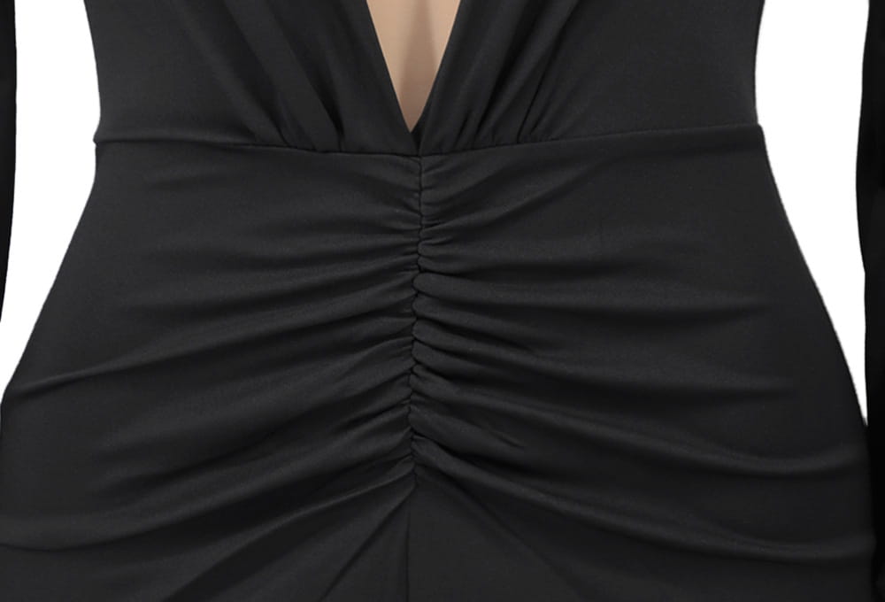 Black velvet evening dress with ruched fabric and a deep v-neckline.
