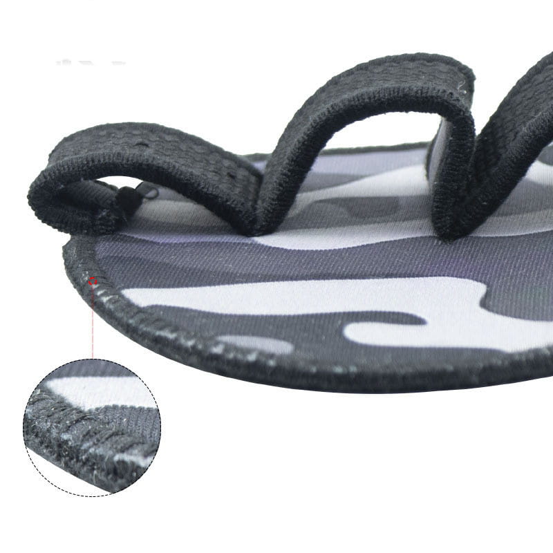 black and white camouflage patterned fabric sandal with a textured elastic strap designed as camouflage weightlifting gloves for training with half finger coverage.