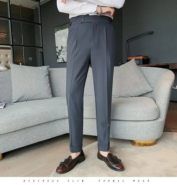 Dark gray slim-fit formal trousers with tailored pleated design and buttoned waistband in Korean style for men.