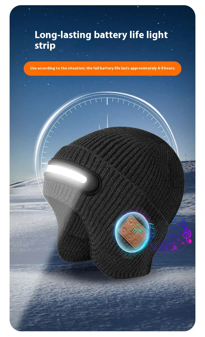 Black knitted led bluetooth beanie hat for running with integrated led light strip across the front and circular bluetooth speaker module on the side.