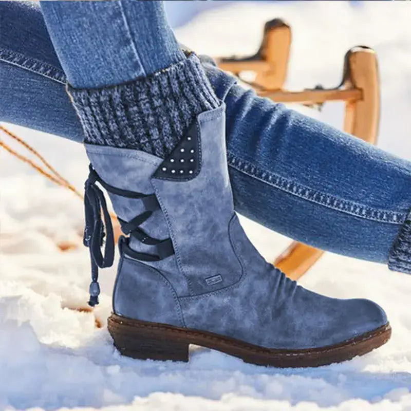 Blue suede ankle boot with black lace-up detailing and a small decorative patch on the side featured as women winter snow boots suede mid calf martin shoes.