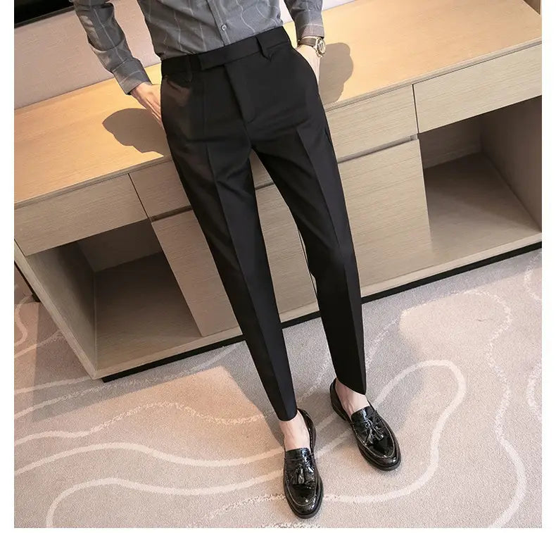 Men’s slim fit British style tailored straight leg black trousers featuring a sleek slim-fit cut with subtle pleats at the waist.