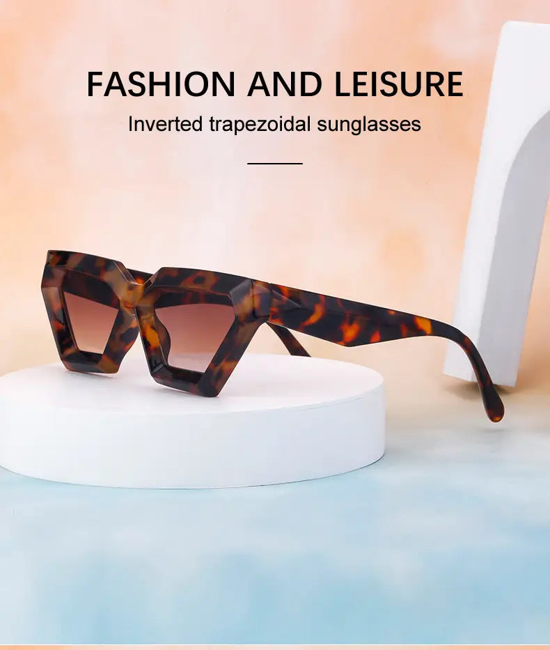 modern irregular cat eye uv400 geometric sunglasses featuring tortoiseshell frames with inverted trapezoidal shape and gradient brown lenses.